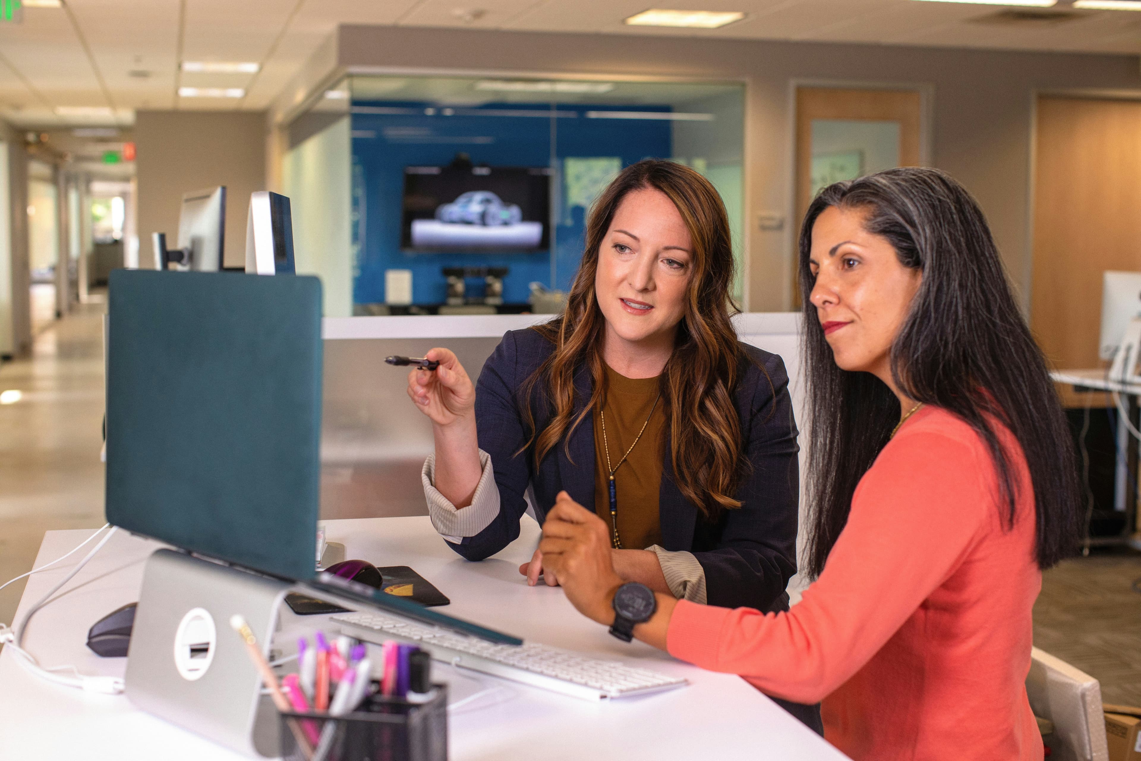 People collaborating on a computer
